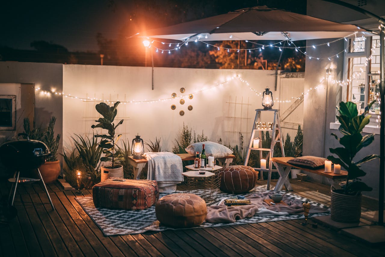 heros-img Inviting outdoor patio setup at night featuring cozy seating, string lights, and decor for perfect relaxation.